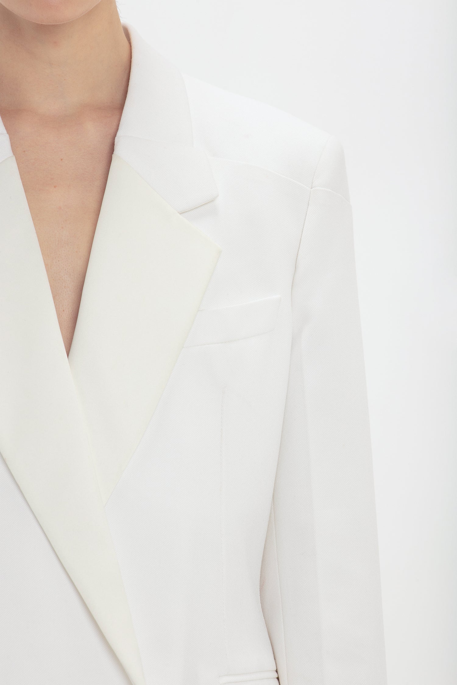 A close up of a person's Exclusive Fold Shoulder Detail Dress In Ivory by Victoria Beckham.