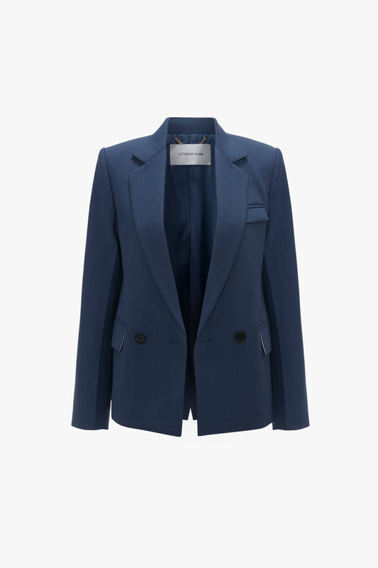 Victoria Beckham shrunken double breasted jacket in heritage blue with notched lapels and black buttons, displayed against a white background.