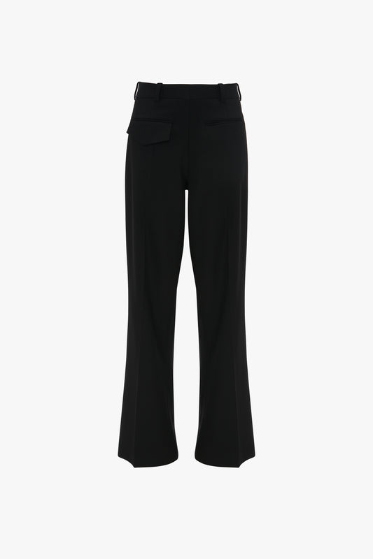 Black high-waisted Reverse Front Trousers In Black with a contemporary silhouette and side pockets, displayed on a white background by Victoria Beckham.