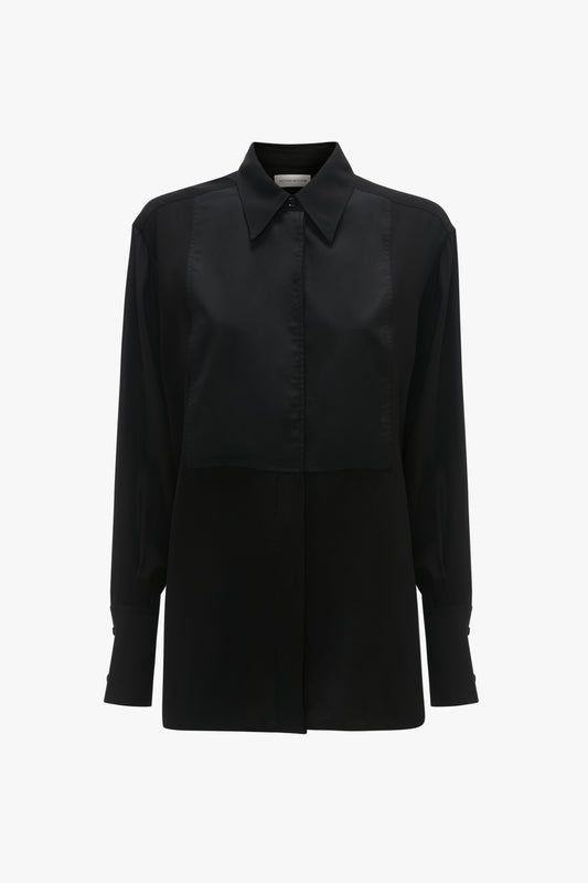 A Victoria Beckham black satin blouse with long sleeves and a concealed button-front closure, isolated on a white background.