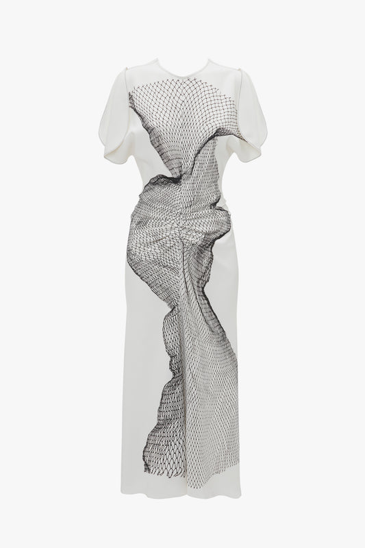 White Victoria Beckham fitted-and-flare dress with black abstract print and ruffled detailing, displayed on a mannequin against a white background.