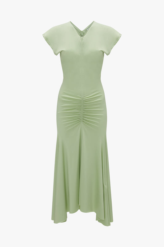 A pale green Sleeveless Rouched Jersey Dress In Pistachio by Victoria Beckham, with a v-neckline, and gathered waist, displayed on a white background.