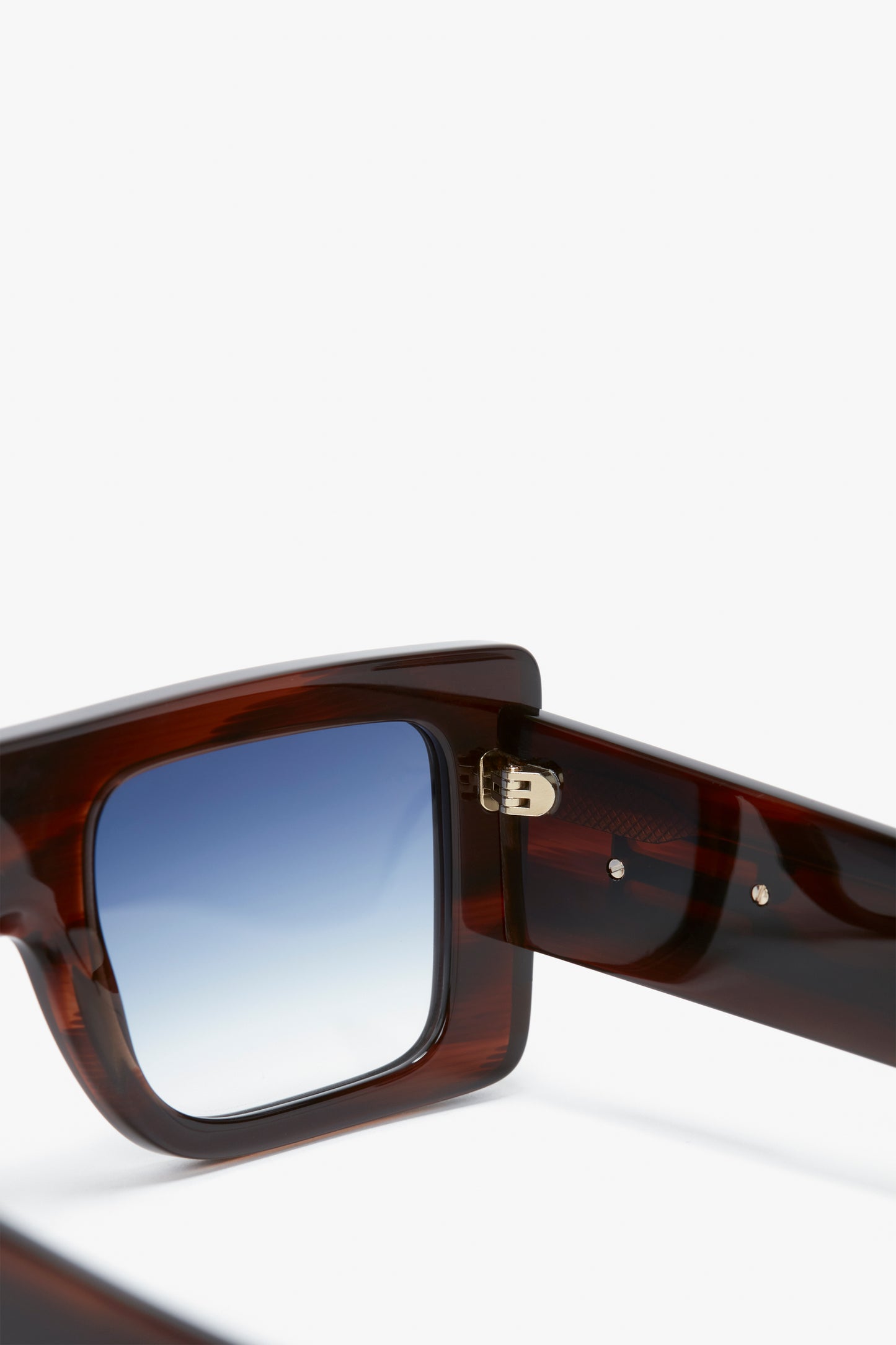 Close-up of Oversized Frame Sunglasses In Brown Horn by Victoria Beckham with a square frame and blue gradient lenses, perfect for the SS24 runway.