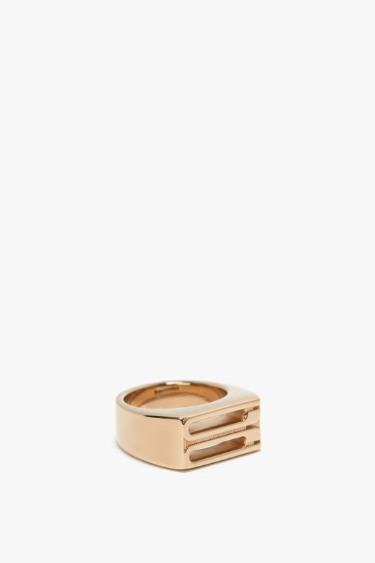 Exclusive Frame Signet Ring In Gold by Victoria Beckham, presented on a white background.