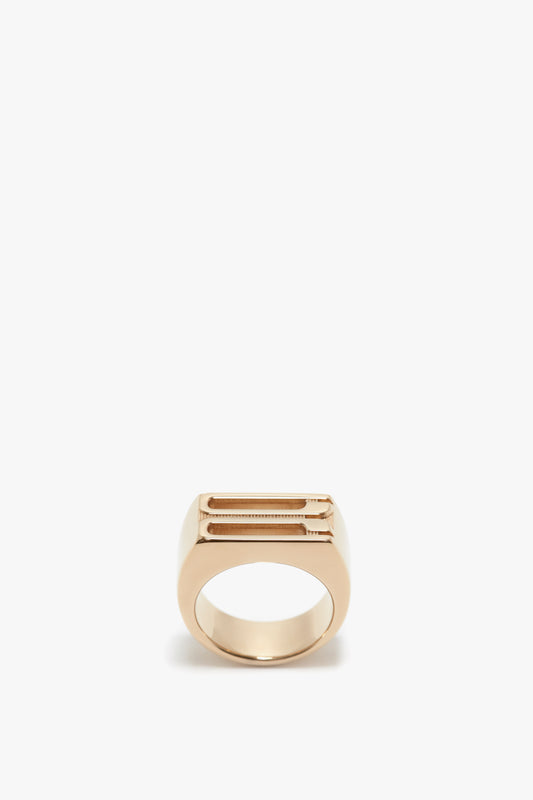 Exclusive Frame Signet Ring In Gold by Victoria Beckham, with a rectangular top plate, isolated on a white background.