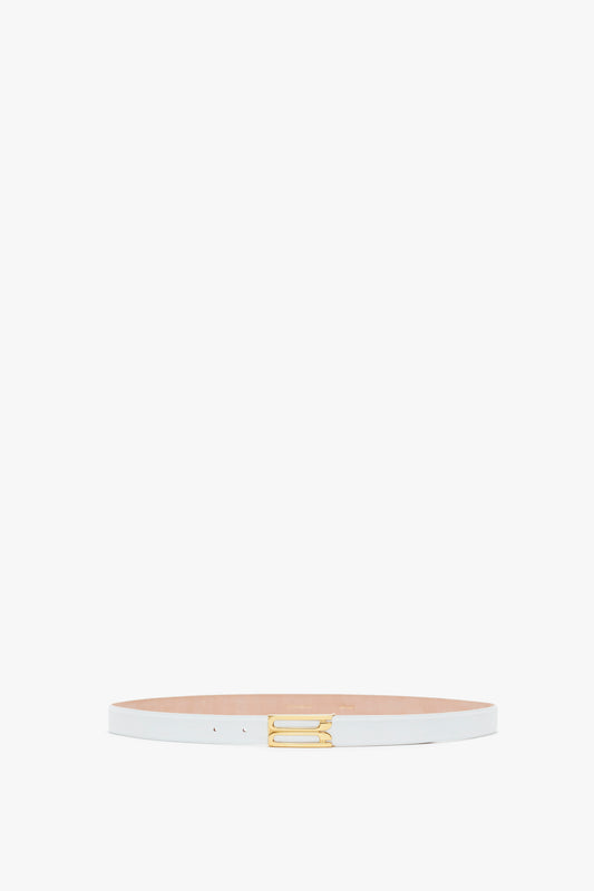 A slender white Exclusive Frame Belt in white leather from Victoria Beckham crafted from smooth calf leather with a gold hardware buckle, centered on a plain white background.