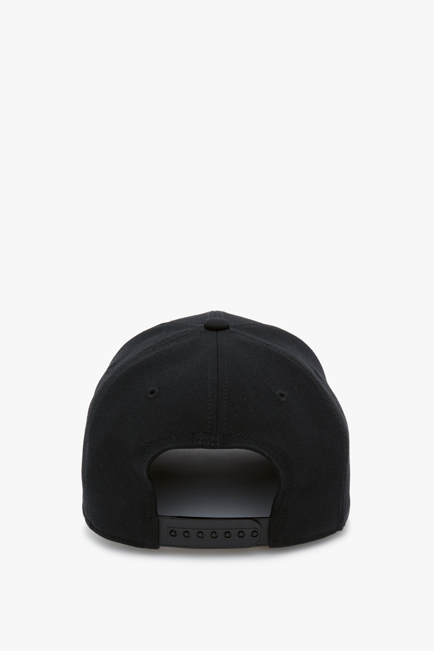 Exclusive Logo Cap in Black by Victoria Beckham viewed from the back, featuring a flat brim and adjustable strap with multiple black snap closures on a white background.