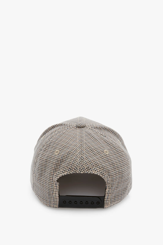Rear view of a Victoria Beckham Logo Cap In Dogtooth Check patterned snapback hat, featuring a black adjustable snap closure, isolated on a white background.