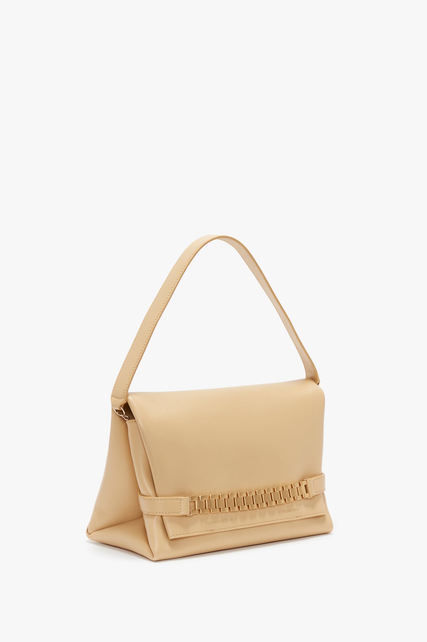 A Chain Pouch Bag With Strap In Sesame Leather by Victoria Beckham with a single top handle and a woven detail on the front, adorned with a gold chain detail for added elegance, set against a white background.