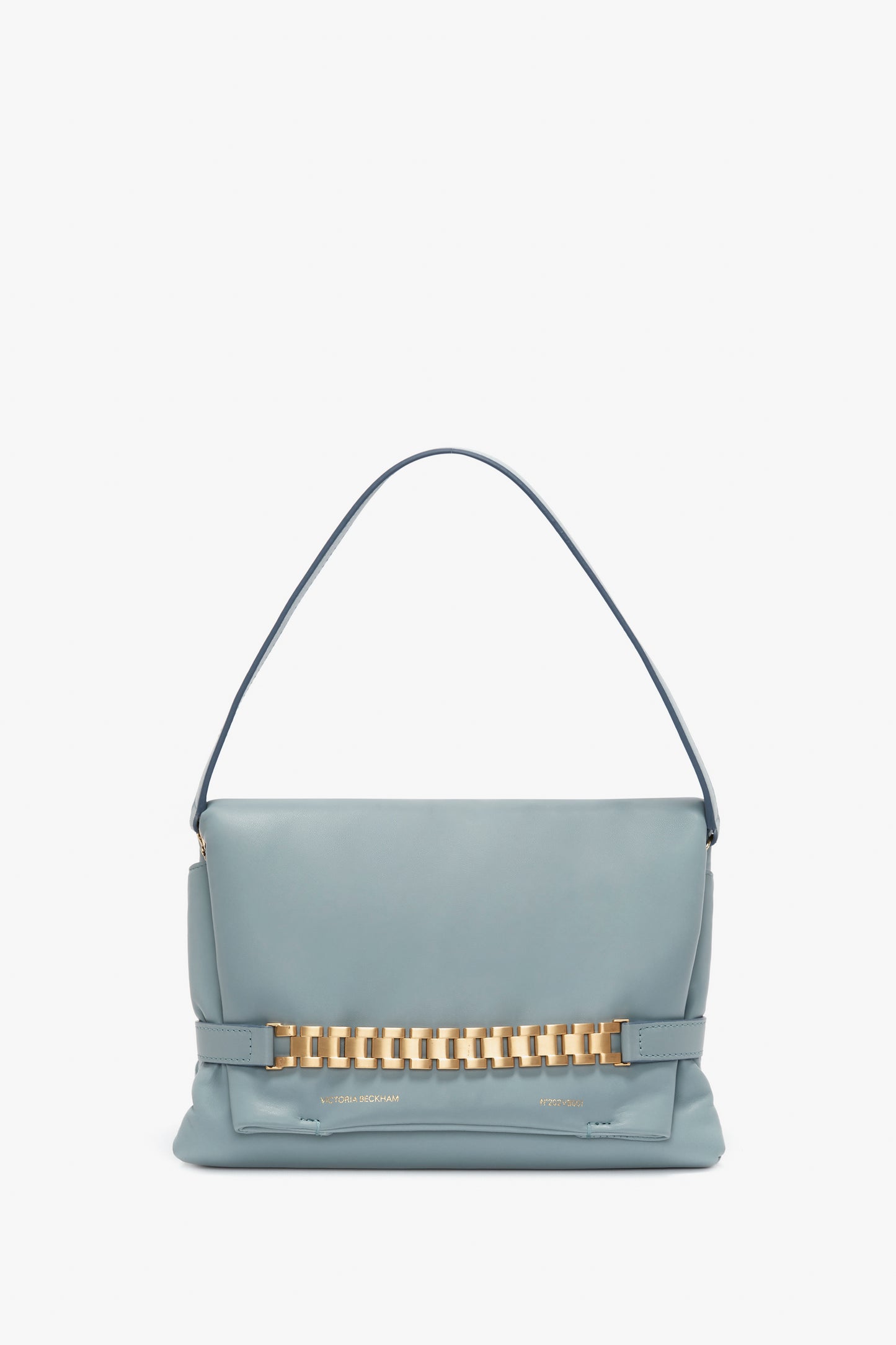 A pale blue Victoria Beckham nappa leather handbag featuring a single handle and a decorative signature gold chain across the front, displayed against a white background.