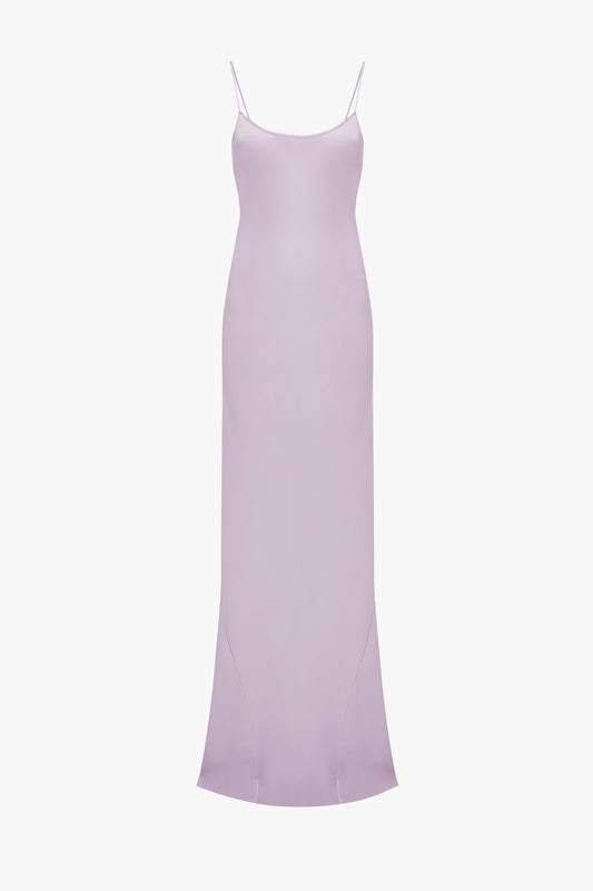 A Low Back Cami Floor-Length Dress In Petunia with thin straps and a gentle flare at the hem, displayed against a white background by Victoria Beckham.