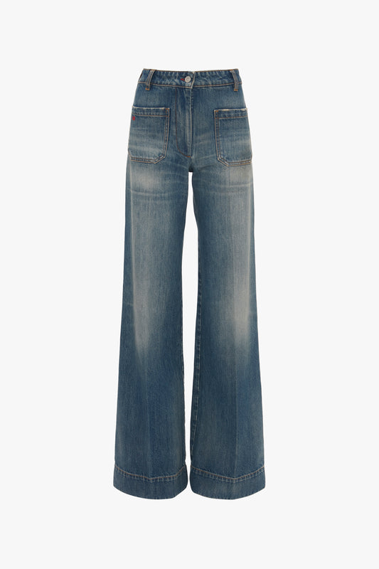 Vintage denim wide-leg Alina Jeans in Indigrey Wash with contrasting stitching and a button closure, displayed against a white background by Victoria Beckham.