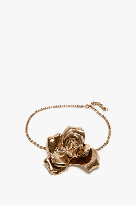 Exclusive Flower Bracelet In Gold by Victoria Beckham with a gold brushed brass finish on a thin adjustable chain, displayed against a white background.