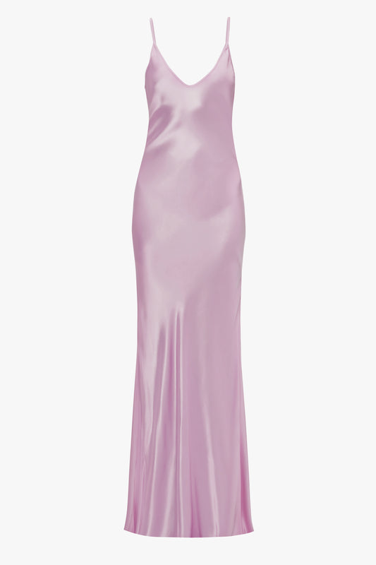 A light pink satin Low Back Cami Floor-Length Dress In Rosa with spaghetti straps, displayed against a plain white background by Victoria Beckham.