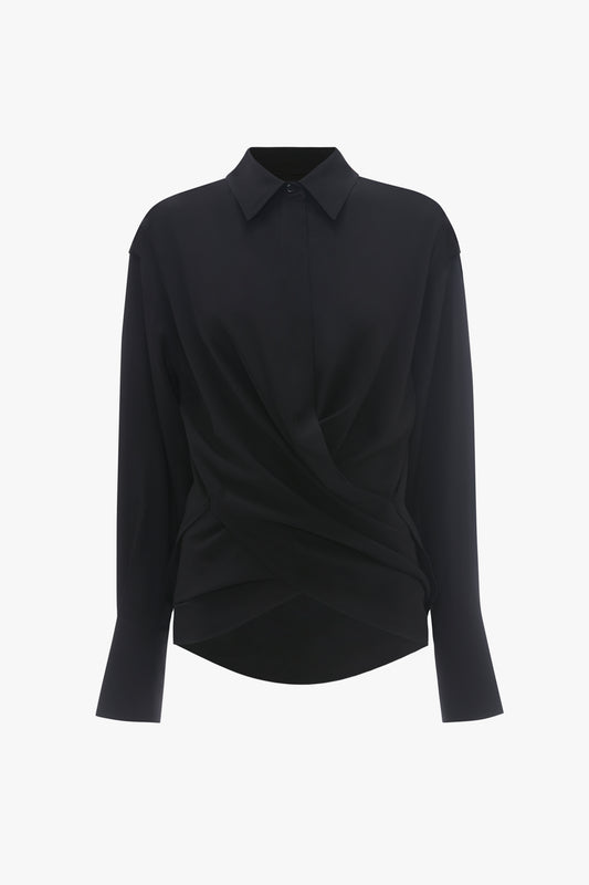 Victoria Beckham black long sleeve silk Wrap Front Blouse with a twisted front design and a pointed collar, displayed on a plain background.
