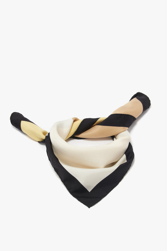A black and white striped luxurious Colour Block Foulard In Macadamia by Victoria Beckham casually laid on a white background.