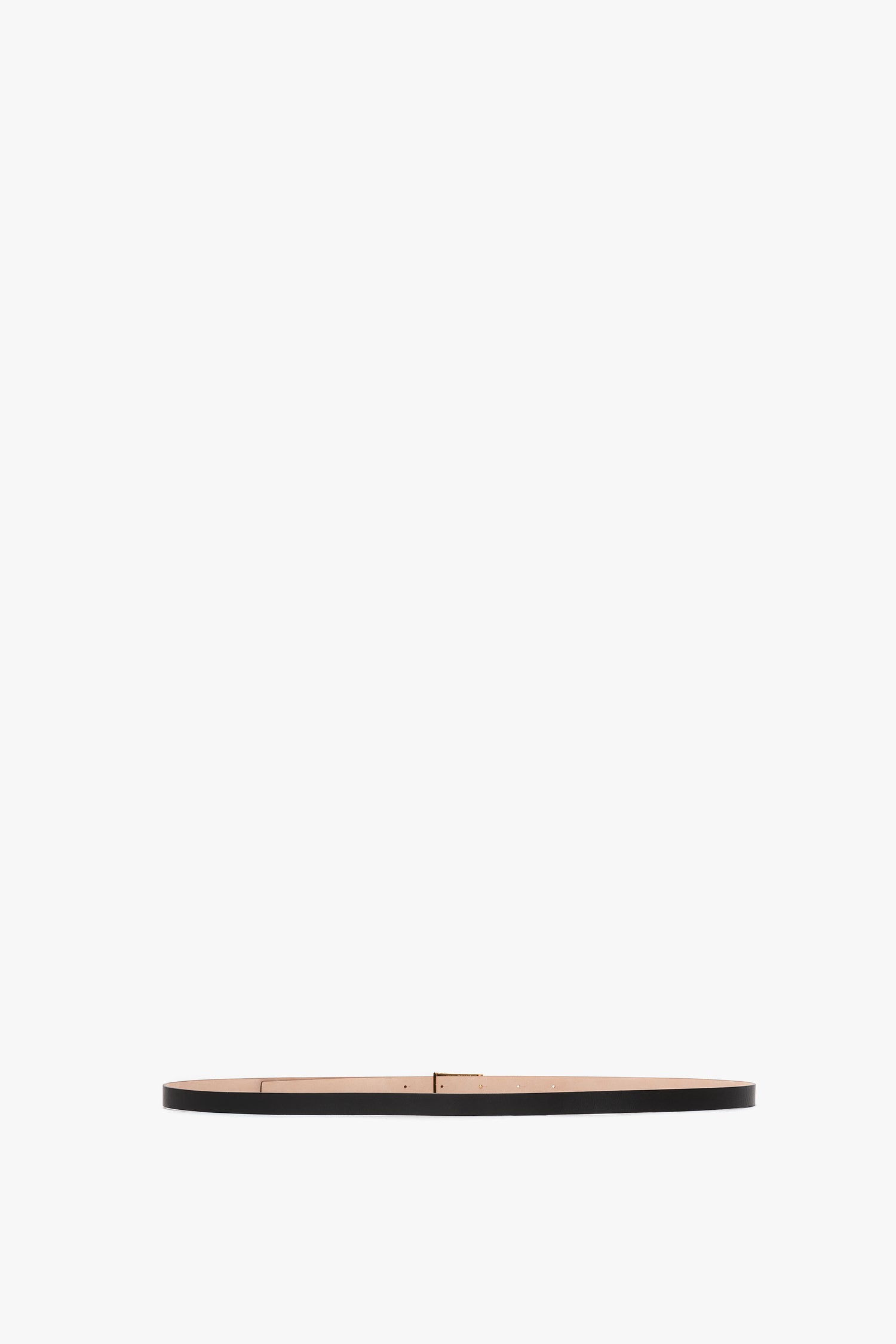 A slim, black calf leather Exclusive Micro Frame belt by Victoria Beckham with a small, rectangular gold buckle, centered on a plain white background.