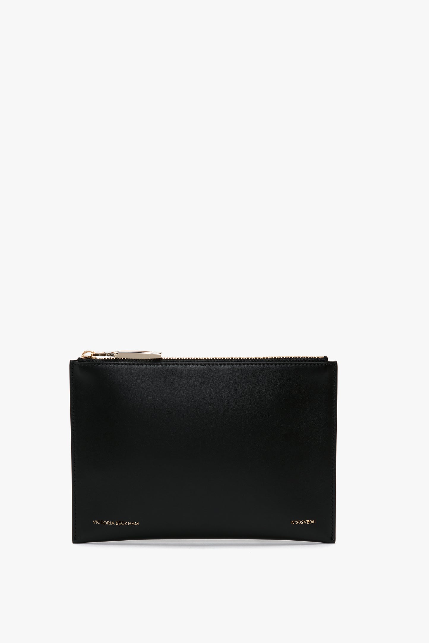 A black leather B Frame Pochette Bag In Black Leather featuring a gold zipper at the top and "Victoria Beckham" logo inscribed in white at the bottom, perfect for carrying your everyday essentials. This compact design is made from smooth calf leather.