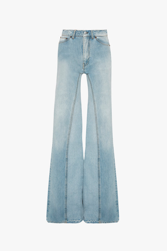 Bianca Jean in Light Blue Denim by Victoria Beckham isolated on a white background.