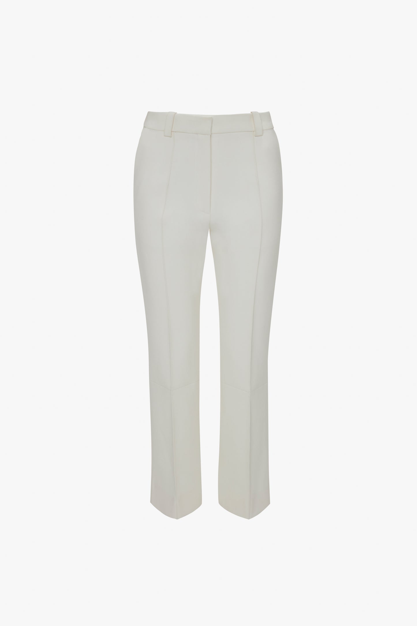 A pair of white Victoria Beckham cropped kick trousers in ivory with a high waist and belt loops, displayed against a plain background.