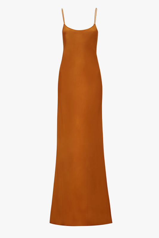 A plain burnt orange Victoria Beckham cami dress with thin straps, displayed on a white background.