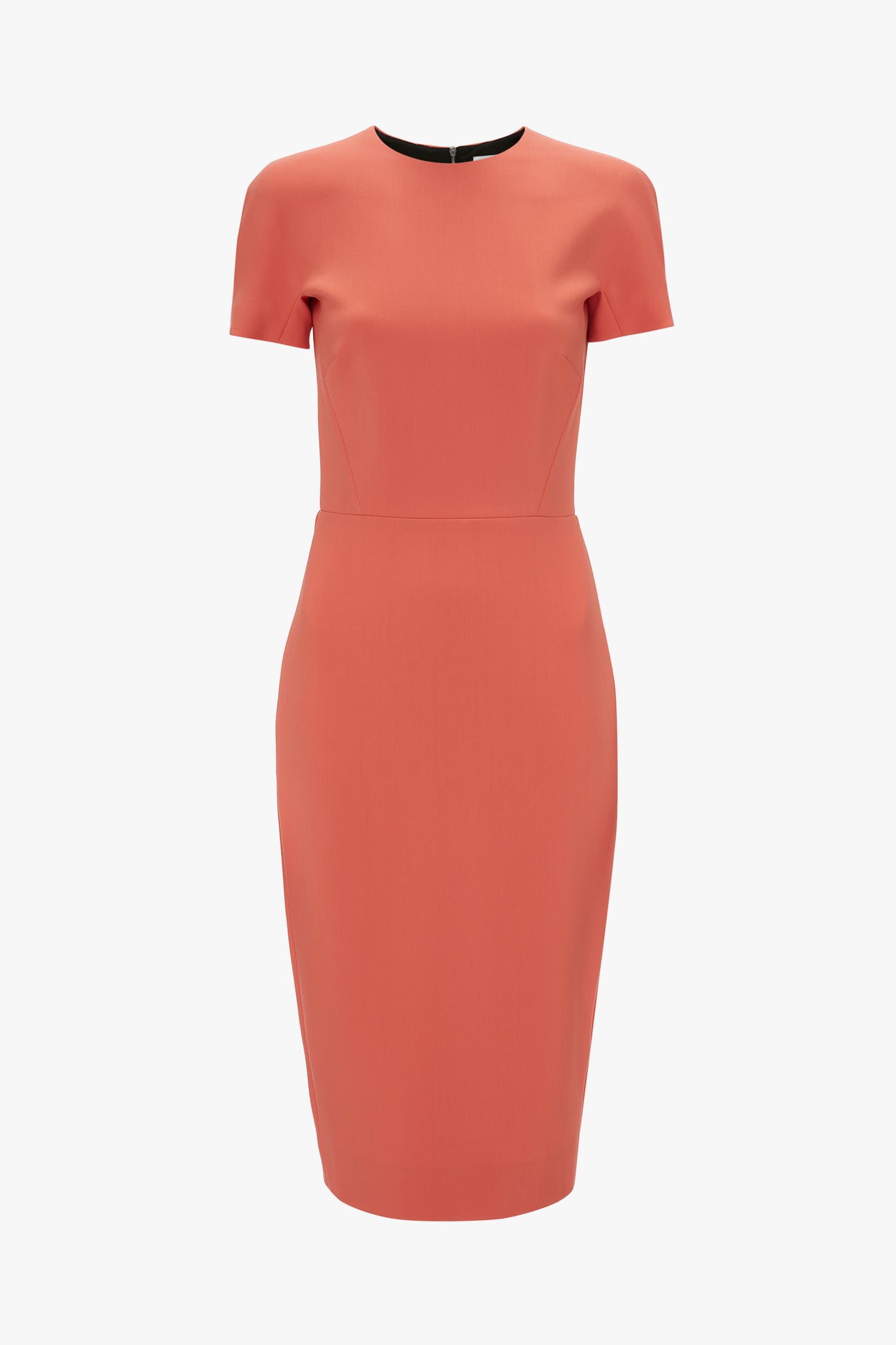 A fitted T-shirt dress in papaya from Victoria Beckham with short sleeves and a boat neckline, isolated on a white background.