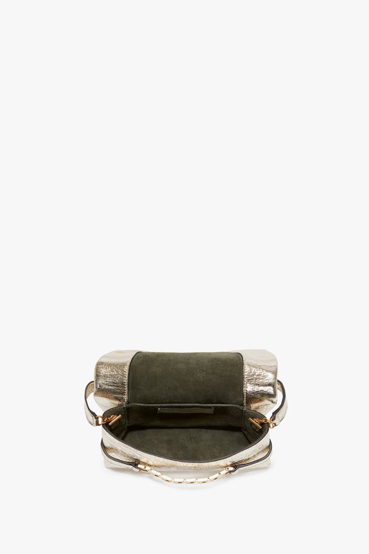 A small, open Victoria Beckham Mini Chain Pouch with a silver base, green body, and bronze handles displayed against a white background.