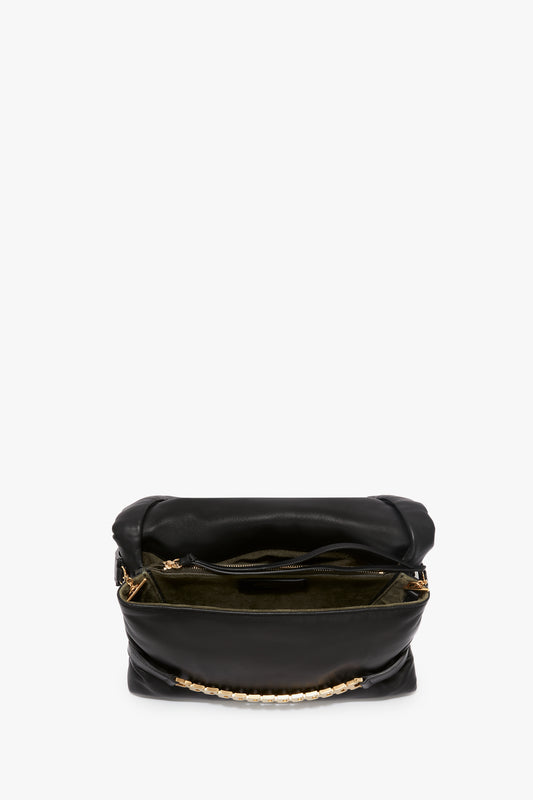 A black nappa leather Puffy Chain Pouch with Strap by Victoria Beckham, standing upright against a white background.