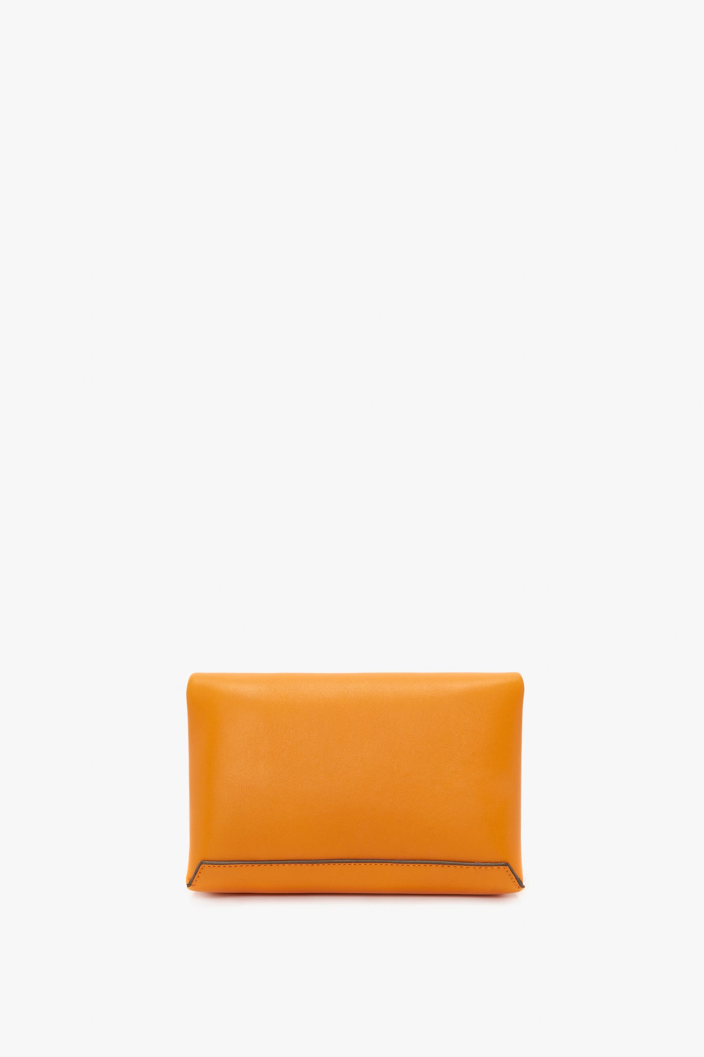 A bright mandarin rectangular clutch purse with a minimalist design, enhanced by a subtle Mini Chain Pouch Bag With Long Strap In Mandarin Leather by Victoria Beckham UK, shown against a plain white background.