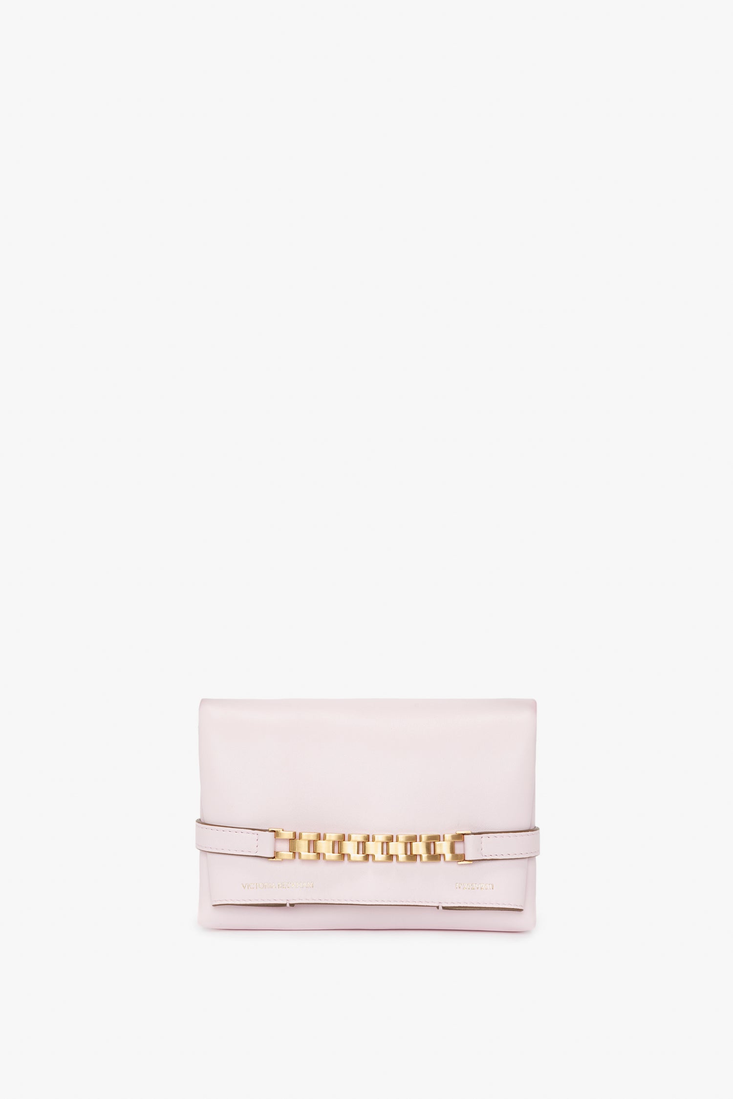 A Victoria Beckham Exclusive Mini Chain Pouch Bag With Long Strap In Bubblegum Pink Leather with a Mini Chain Pouch accent in the center, laid against a white background.