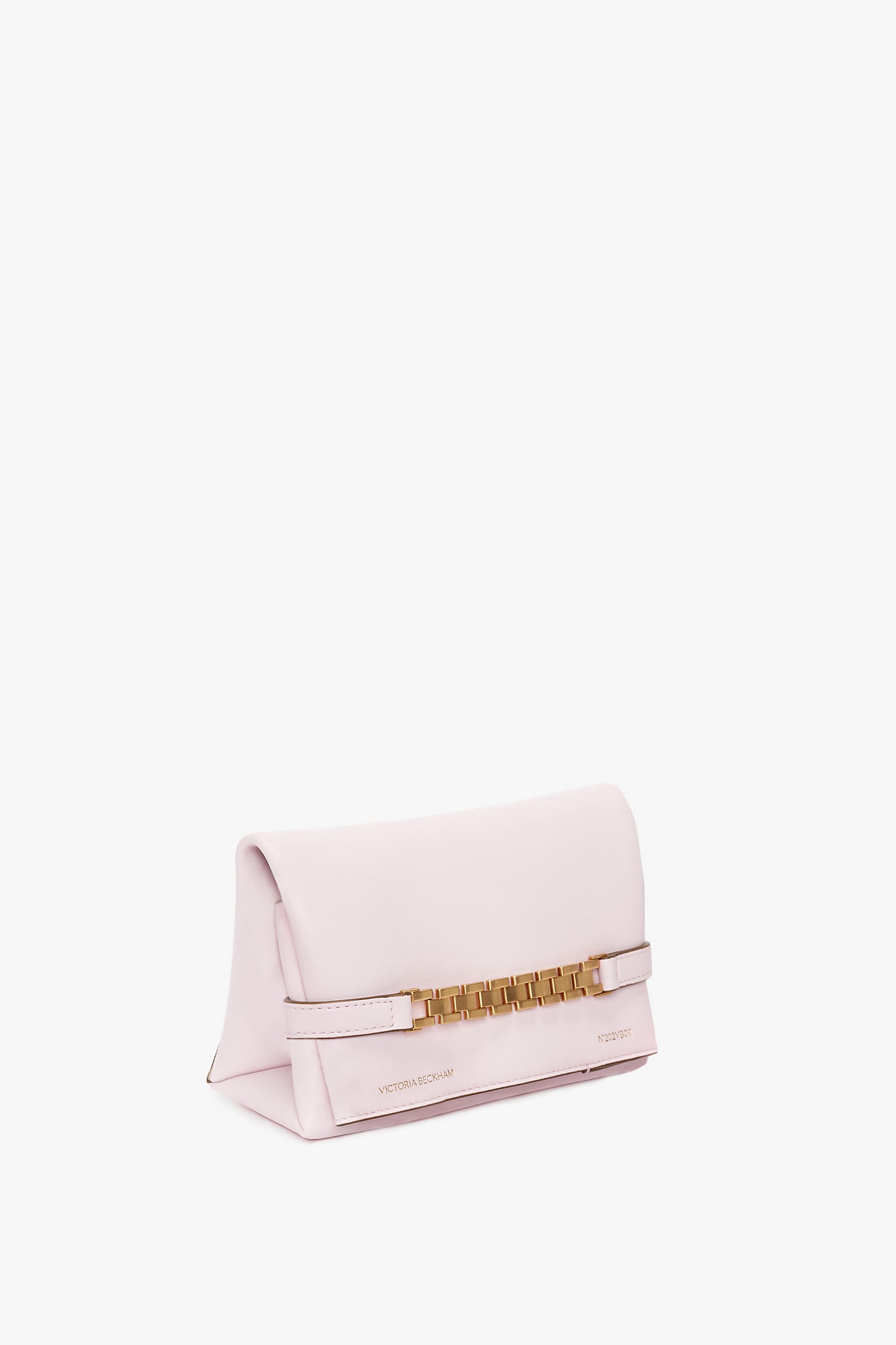 A bubblegum pink clutch bag with a gold chain detail and a flap closure, featuring a detachable strap for versatile carrying is the Exclusive Mini Chain Pouch Bag With Long Strap In Bubblegum Pink Leather by Victoria Beckham.