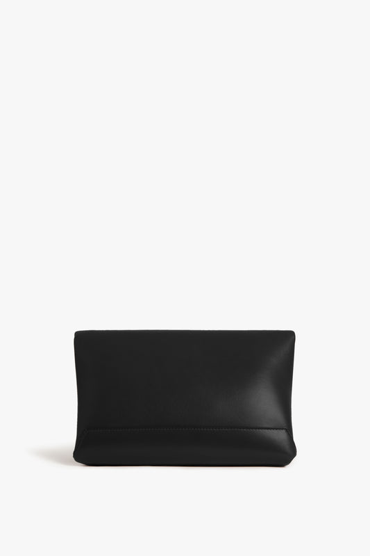 A Victoria Beckham Chain Pouch Bag in Black Leather with gold-tone hardware on a white background.