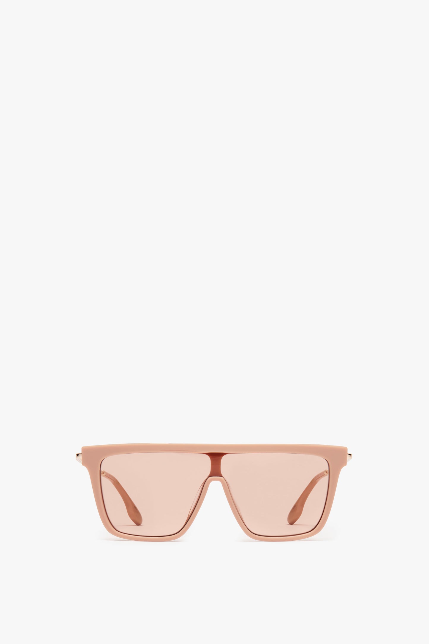A pair of Victoria Beckham Rectangular Shield Sunglasses In Nude with thick frames and slightly tinted lenses is centered against a white background.