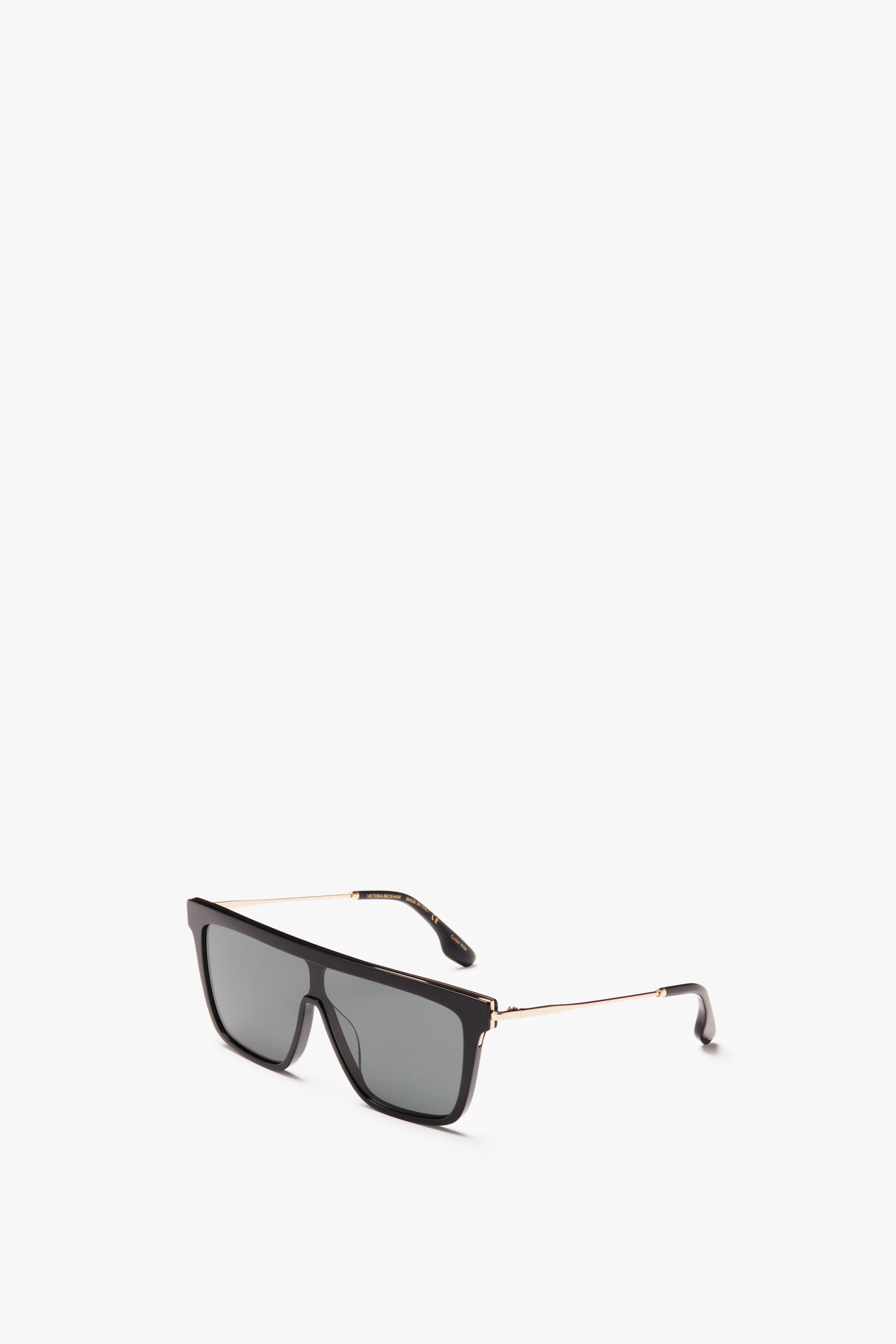 A pair of Victoria Beckham rectangular shield sunglasses in black, featuring a golden metal frame on a white background.