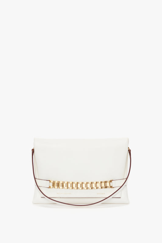 White Nappa leather chain pouch with strap in white leather, Victoria Beckham, isolated on a white background.