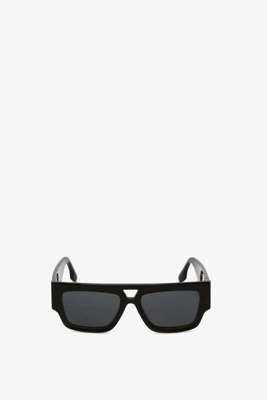 Victoria Beckham black sunglasses with a rectangular acetate frame and tinted lenses, isolated on a white background.