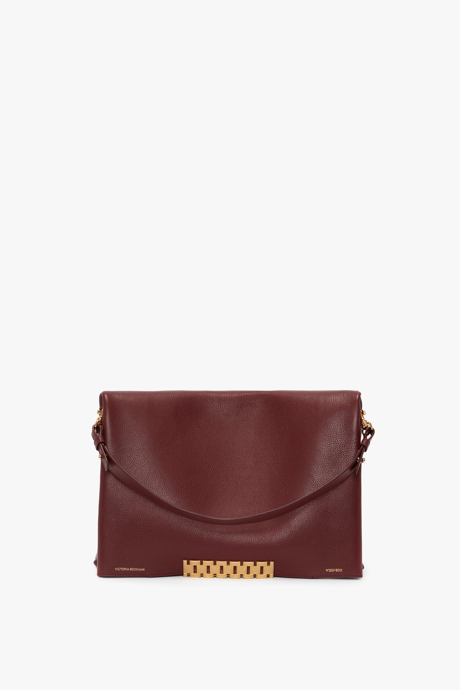 A Victoria Beckham Jumbo Chain Pouch Bag In Bordeaux Leather with a gold chain strap and decorative gold clasp, featuring a detachable strap for versatile wear.