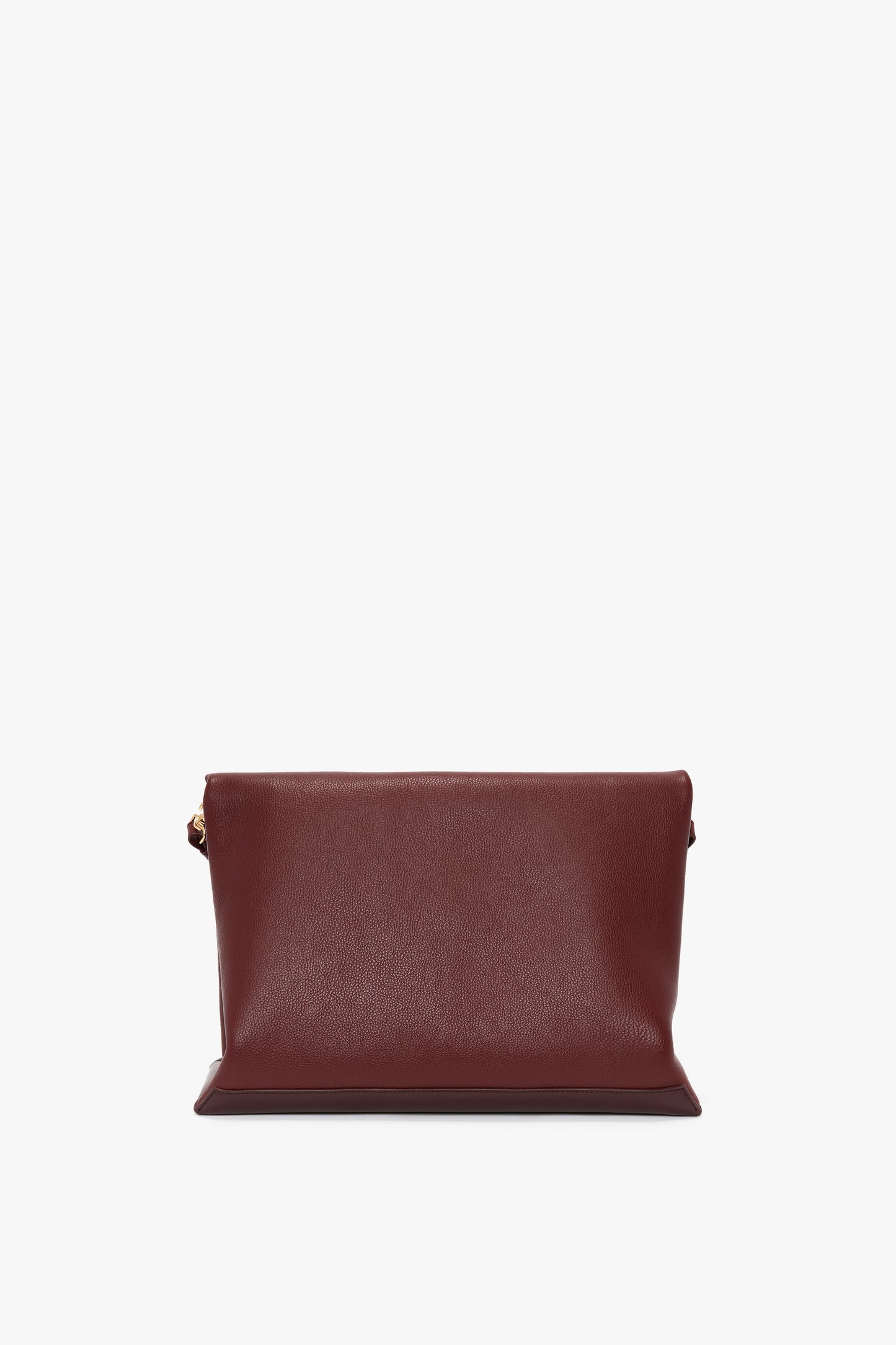 A Victoria Beckham Jumbo Chain Pouch Bag In Bordeaux Leather with a minimalist design and gold-toned side accents, featuring a detachable strap, photographed on a white background.