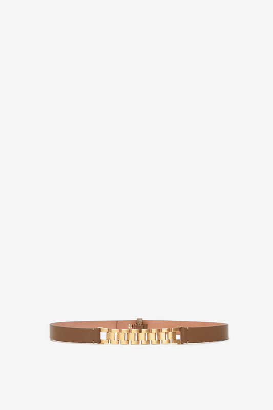 Watch Strap Detail Belt in Khaki-Brown calf-leather belt with a golden block-letter buckle on a white background by Victoria Beckham UK.