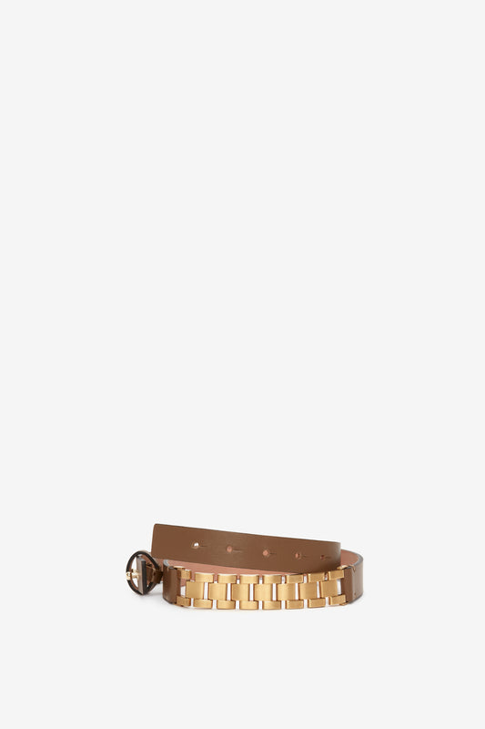 Watch Strap Detail Belt in Khaki-Brown by Victoria Beckham UK, with a golden square buckle and matching golden square studs, displayed against a plain white background, perfectly complementing the VB look.
