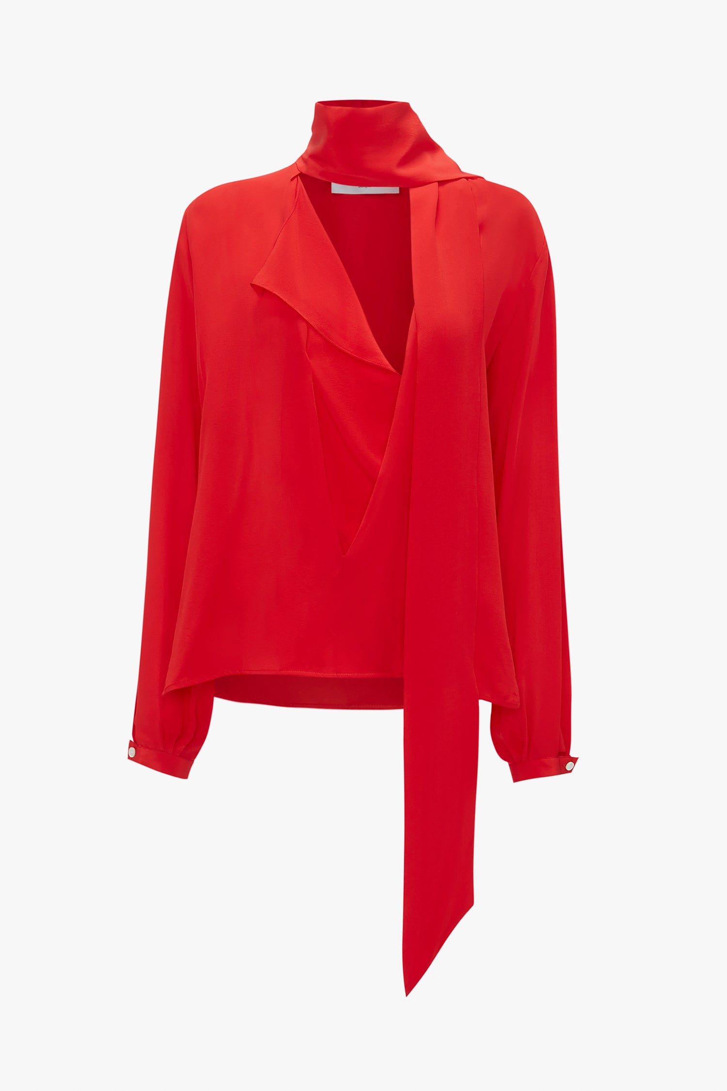 A vibrant red long-sleeve Scarf Neck Blouse In Bright Red by Victoria Beckham with a sophisticated draped front and an attached scarf detail on the deep-V neckline.