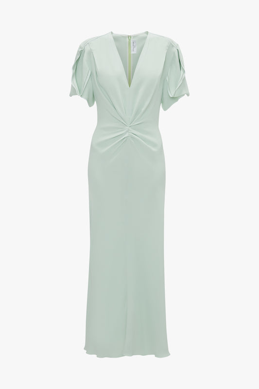 Mint green Gathered V-neck evening dress with twisted front detail and ruffled sleeves, displayed against a white background by Victoria Beckham.
