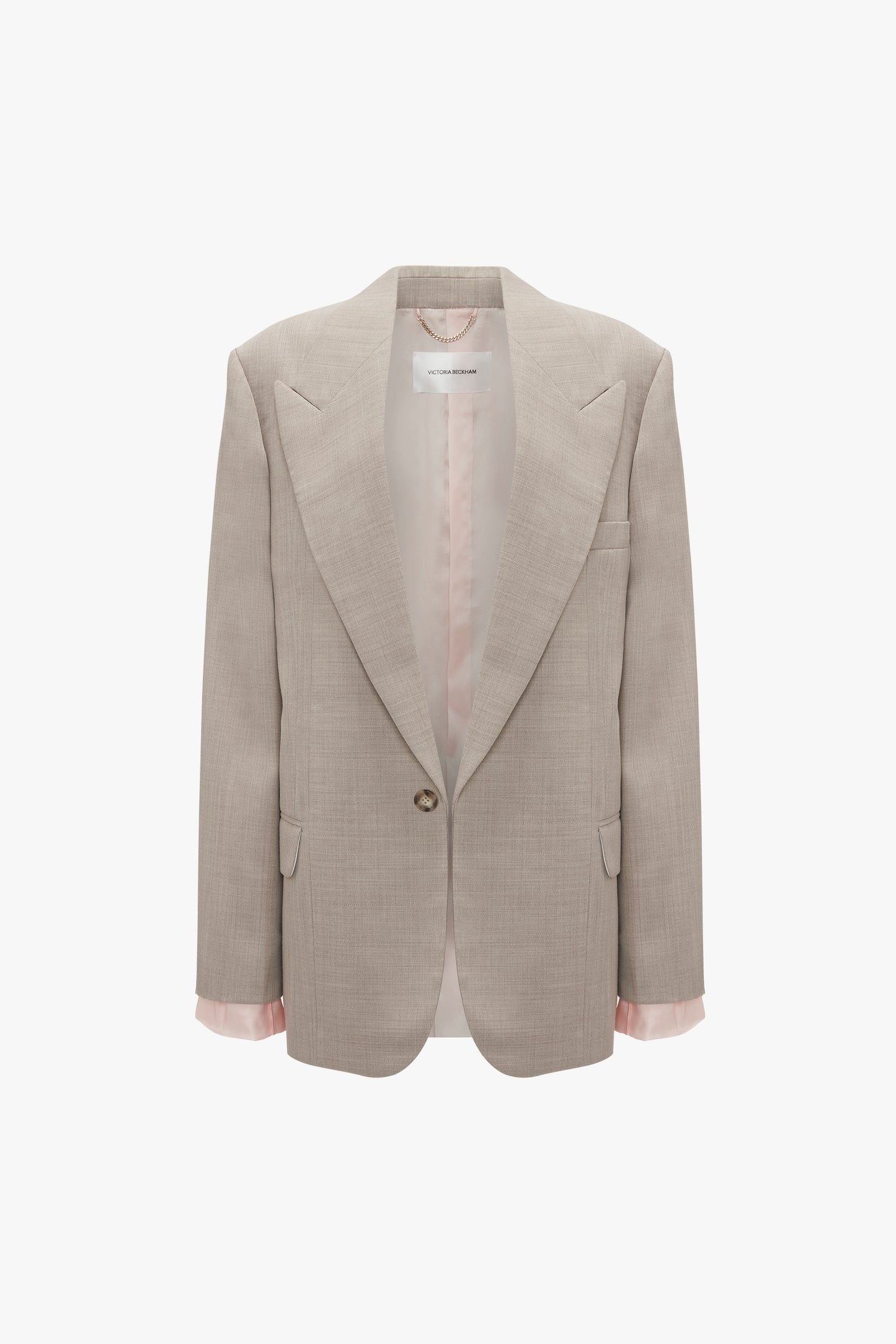 A Darted Sleeve Tailored Jacket In Sesame by Victoria Beckham with pointed shoulders and a single button, featuring a light pink lining and contemporary detailing.