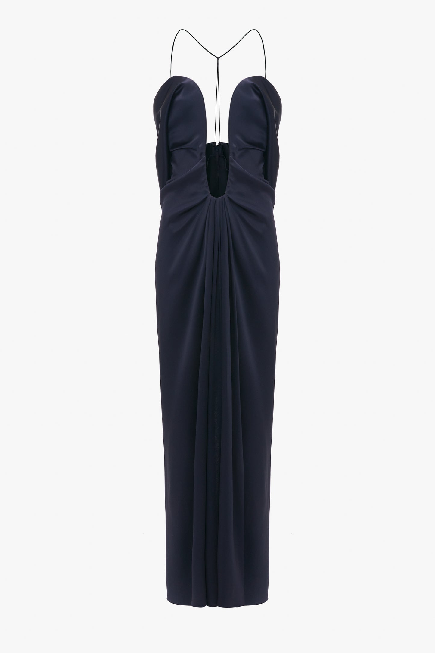 Navy blue evening gown with a plunging neckline and Victoria Beckham Frame Detail Cut-Out Cami Dress In Navy, isolated on a white background.