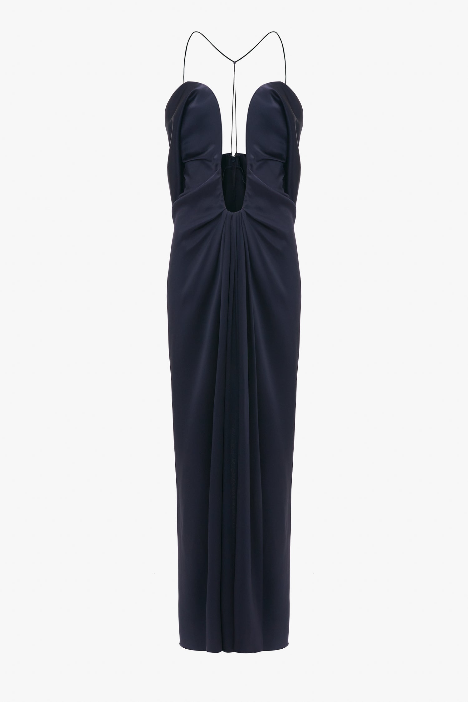 Navy blue evening gown with a plunging neckline and Victoria Beckham Frame Detail Cut-Out Cami Dress In Navy, isolated on a white background.