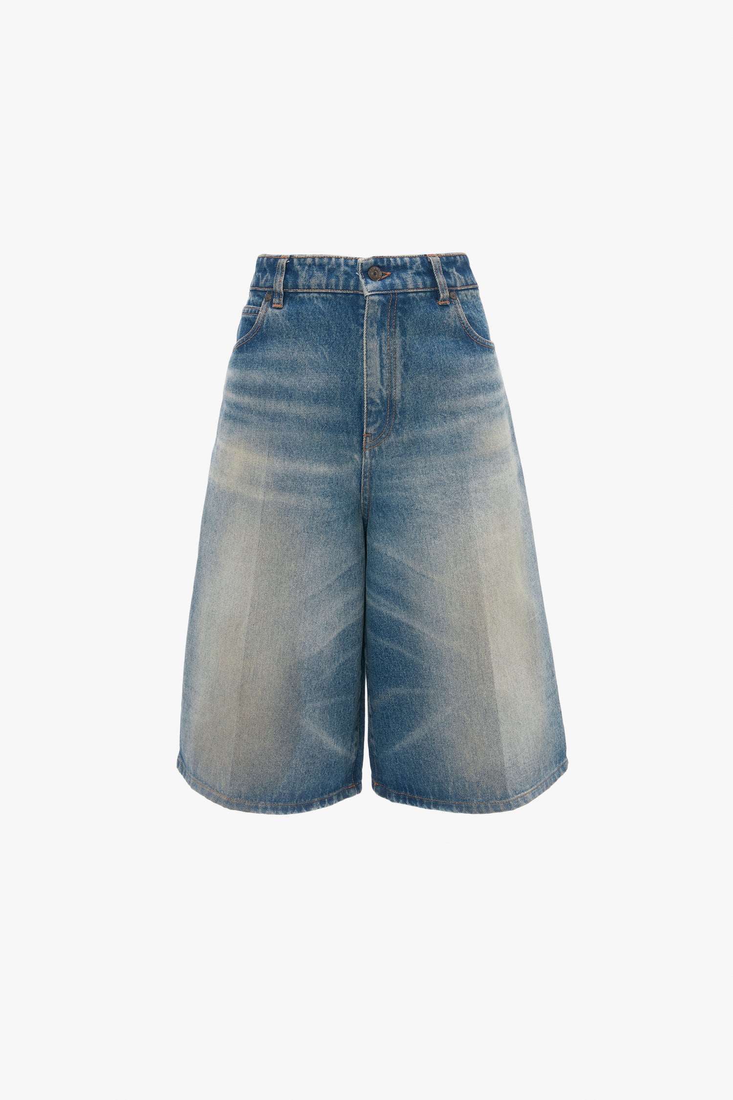 A pair of Victoria Beckham Oversized Bermuda Short In Antique Indigo Wash, embodying masculine-inspired Bermuda Shorts style.
