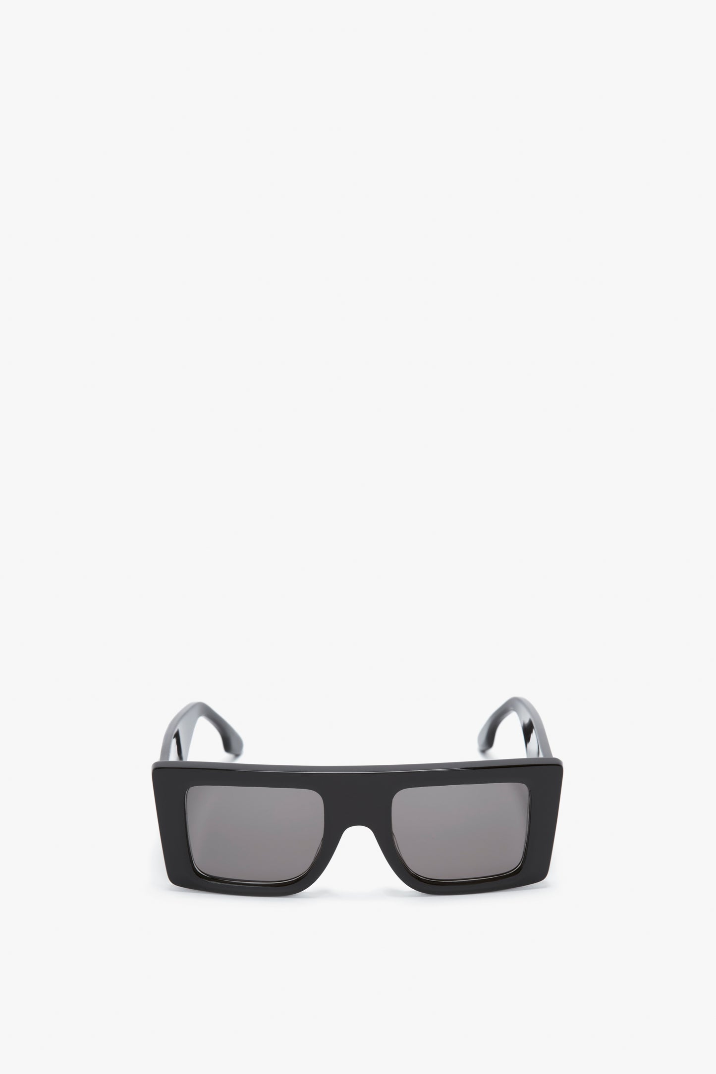 Rectangular black-framed Oversized Frame Sunglasses In Black with dark lenses on a white background, featuring Victoria Beckham’s signature B frame buckle.