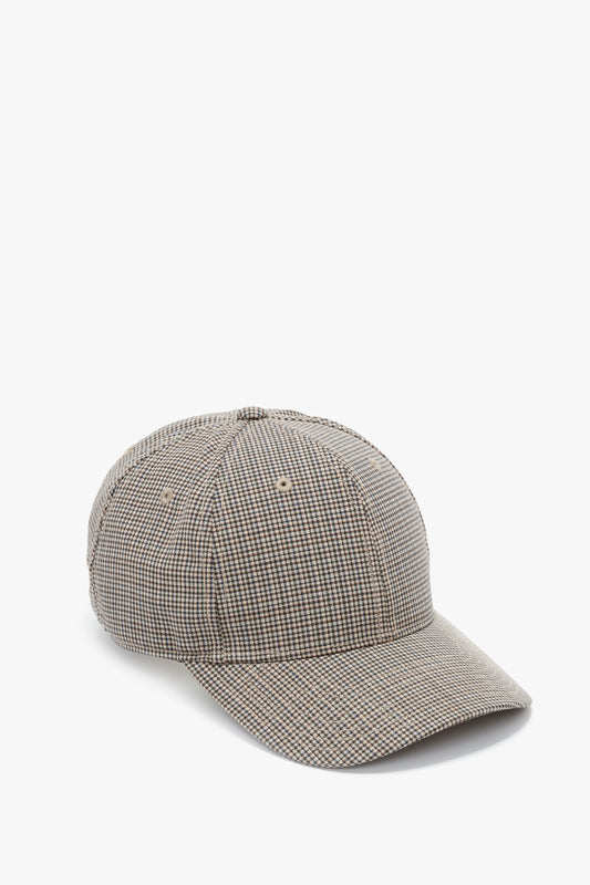 A Logo Cap In Dogtooth Check by Victoria Beckham isolated on a white background.