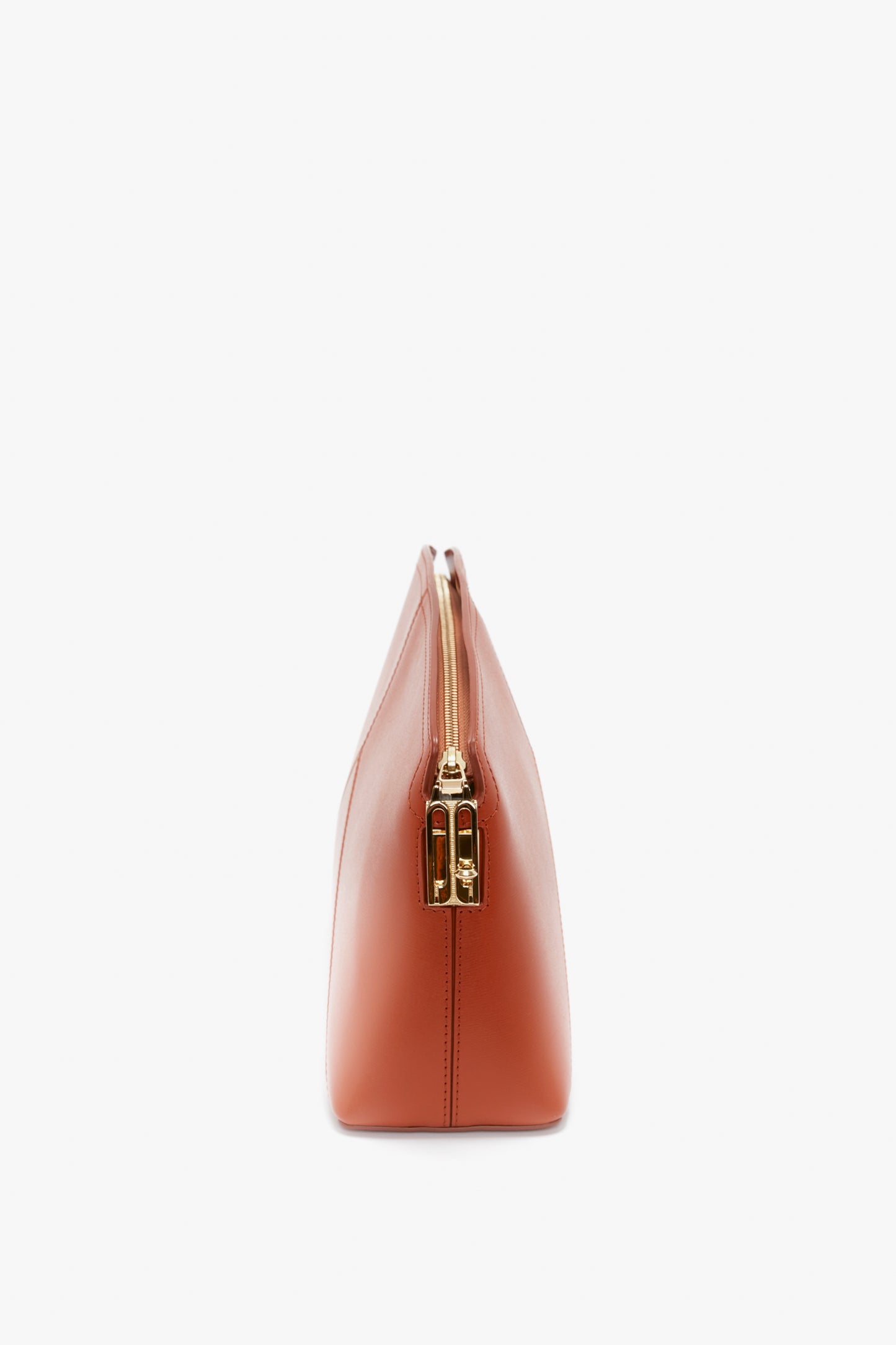Side view of a Victoria Beckham Victoria Clutch Bag In Tan Leather featuring a gold zipper closure and branded padlock.
