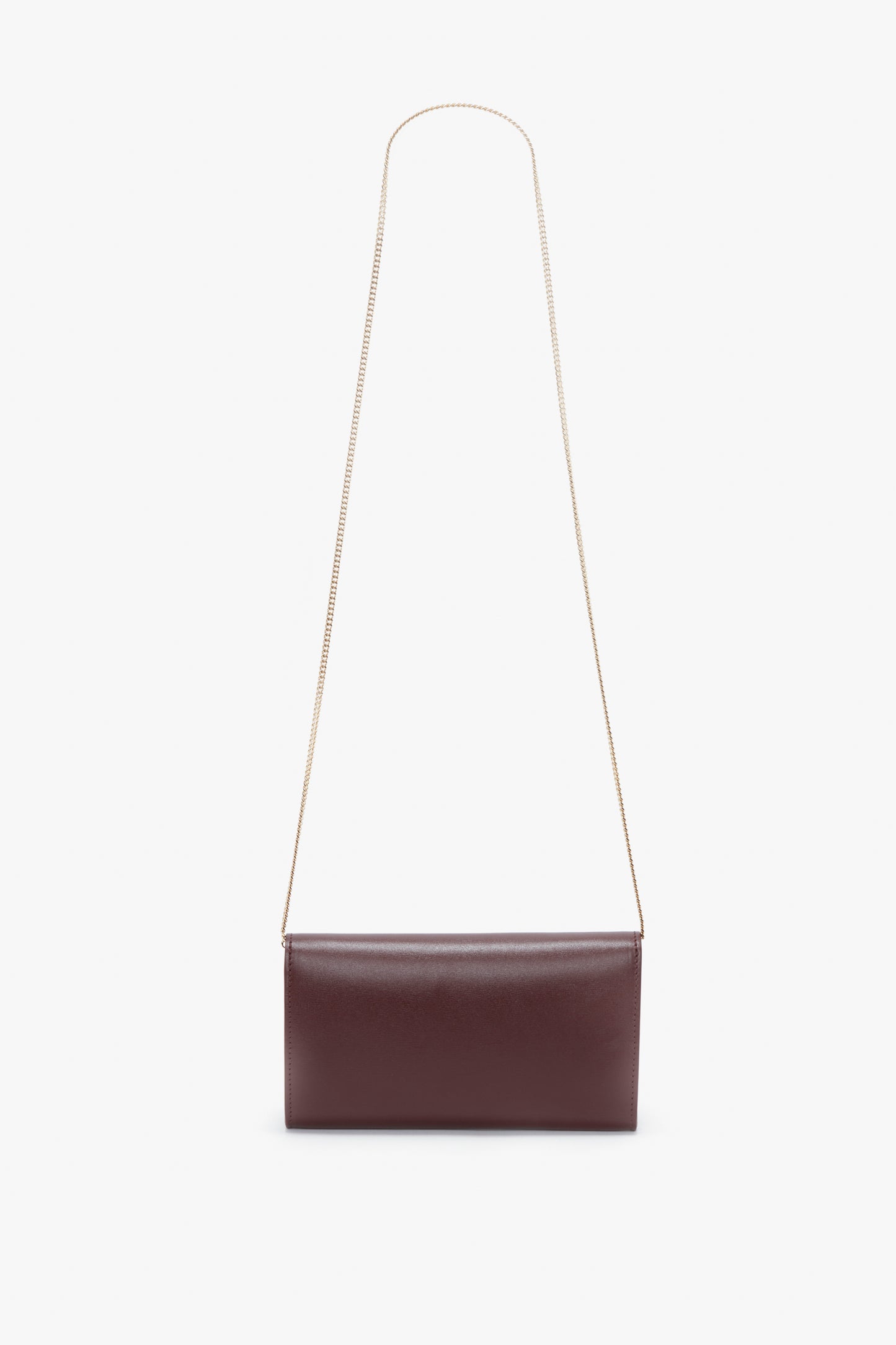 A rectangular maroon palmellato leather bag with a gold chain strap, displayed against a white background, replaced with Wallet On Chain In Burgundy Leather by Victoria Beckham.